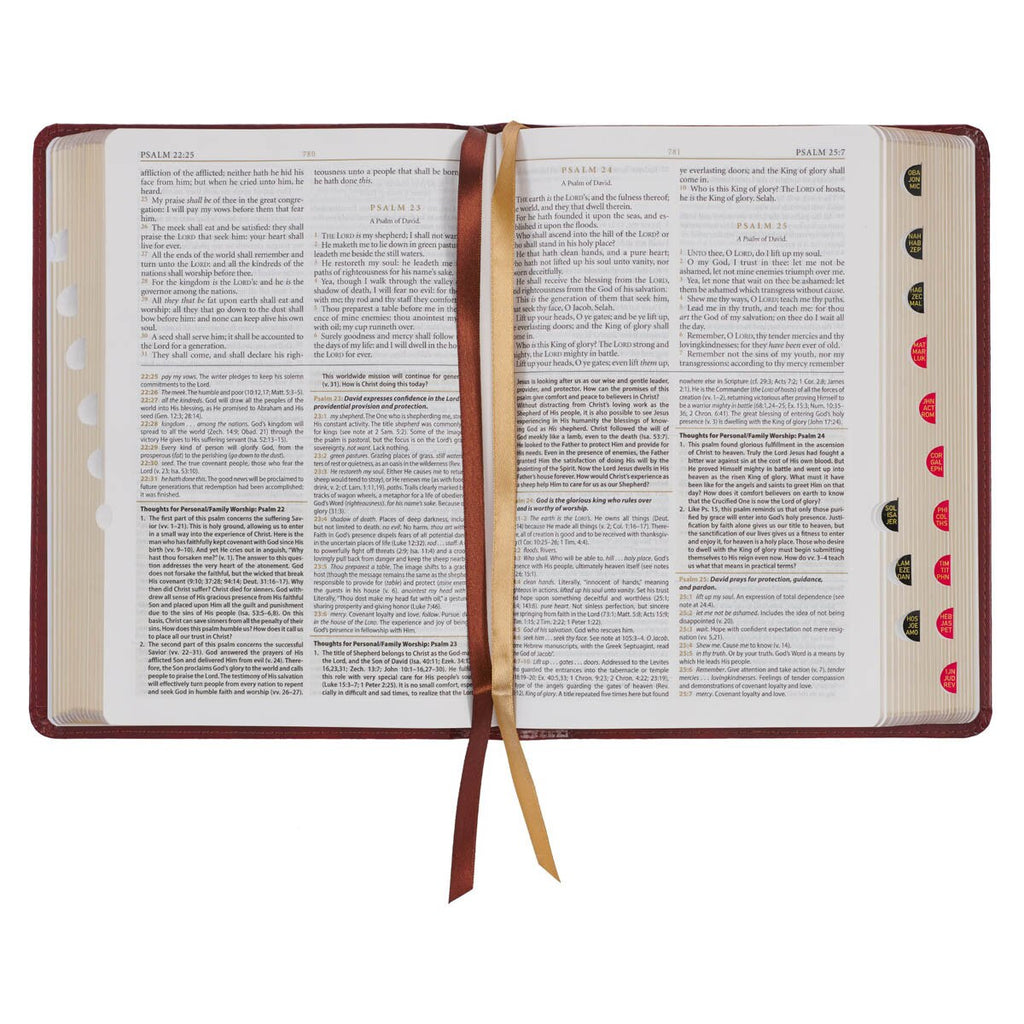 Open book with a ribbon marker on a white background