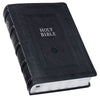 Black leather-bound Bible on a white background