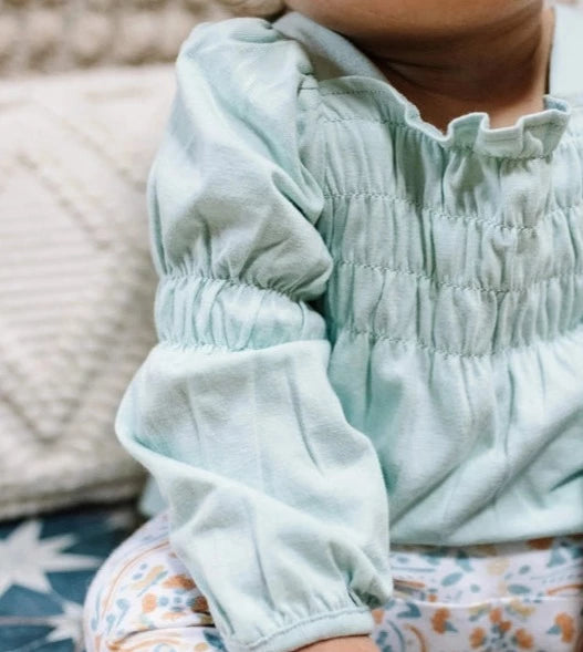 burts bee smocked tunic and capri legging set on a white background