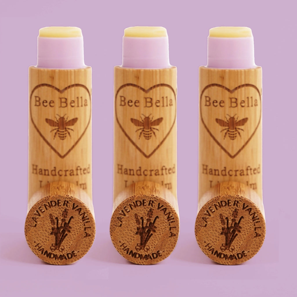 bee bella lavender vanilla lip balm on a purple background