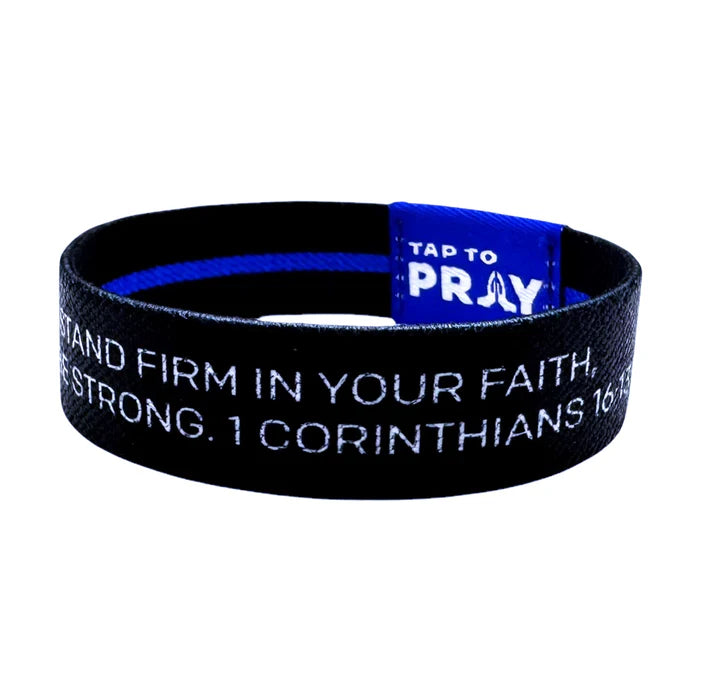 Black wristband with blue interior and motivational text on a white background