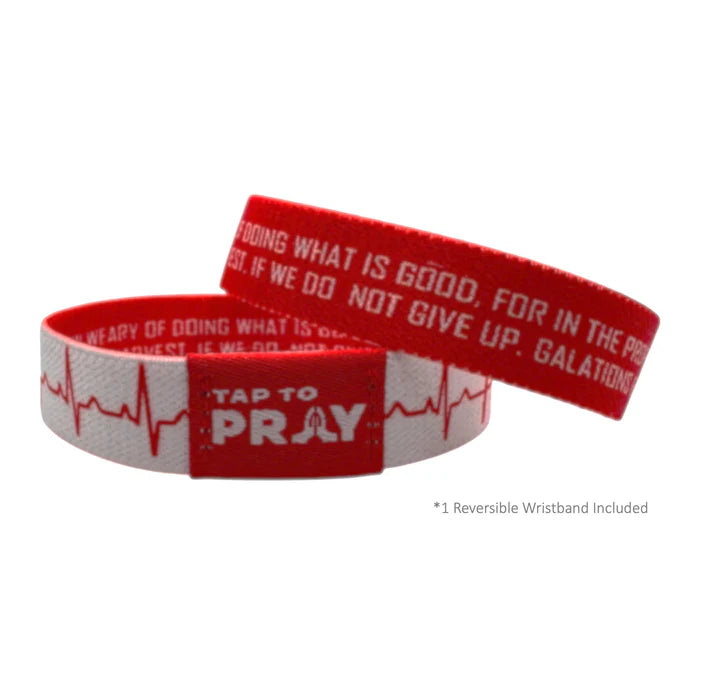Red and white wristband with motivational text on a white background
