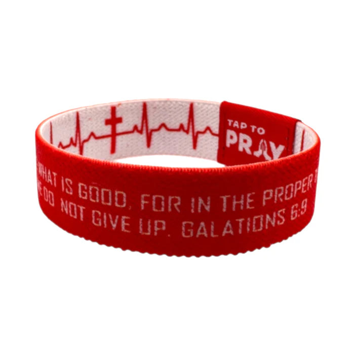Red wristband with text and design on a white background
