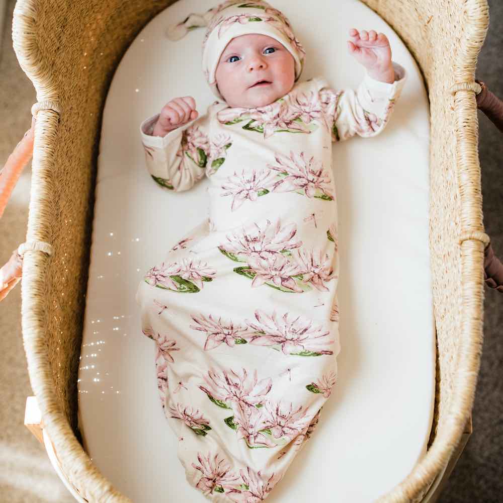 milk barn vintage floral newborn hat and gown set on a white background