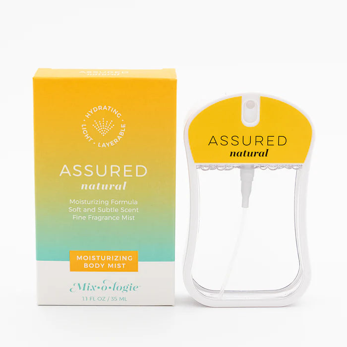 Assured natural body mist packaging with yellow cap and gradient box on a white background