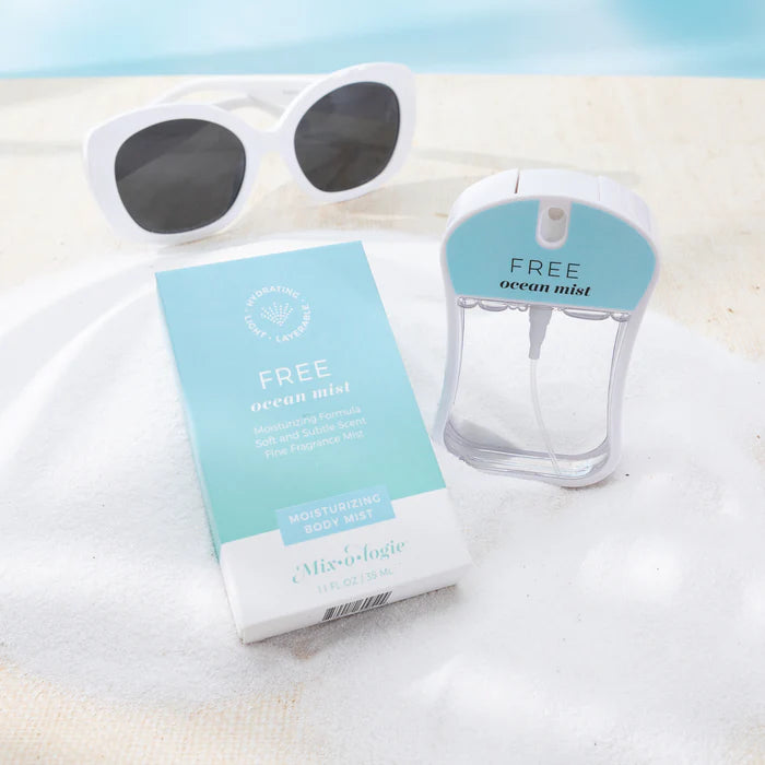 Free ocean mist body wash packaging with sunglasses on a white surface