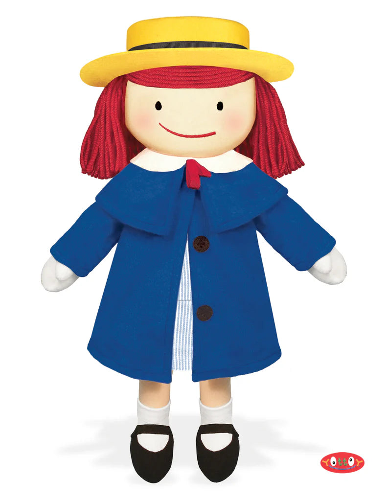 Toy figure with red hair, yellow hat, blue coat, and black shoes on a white background