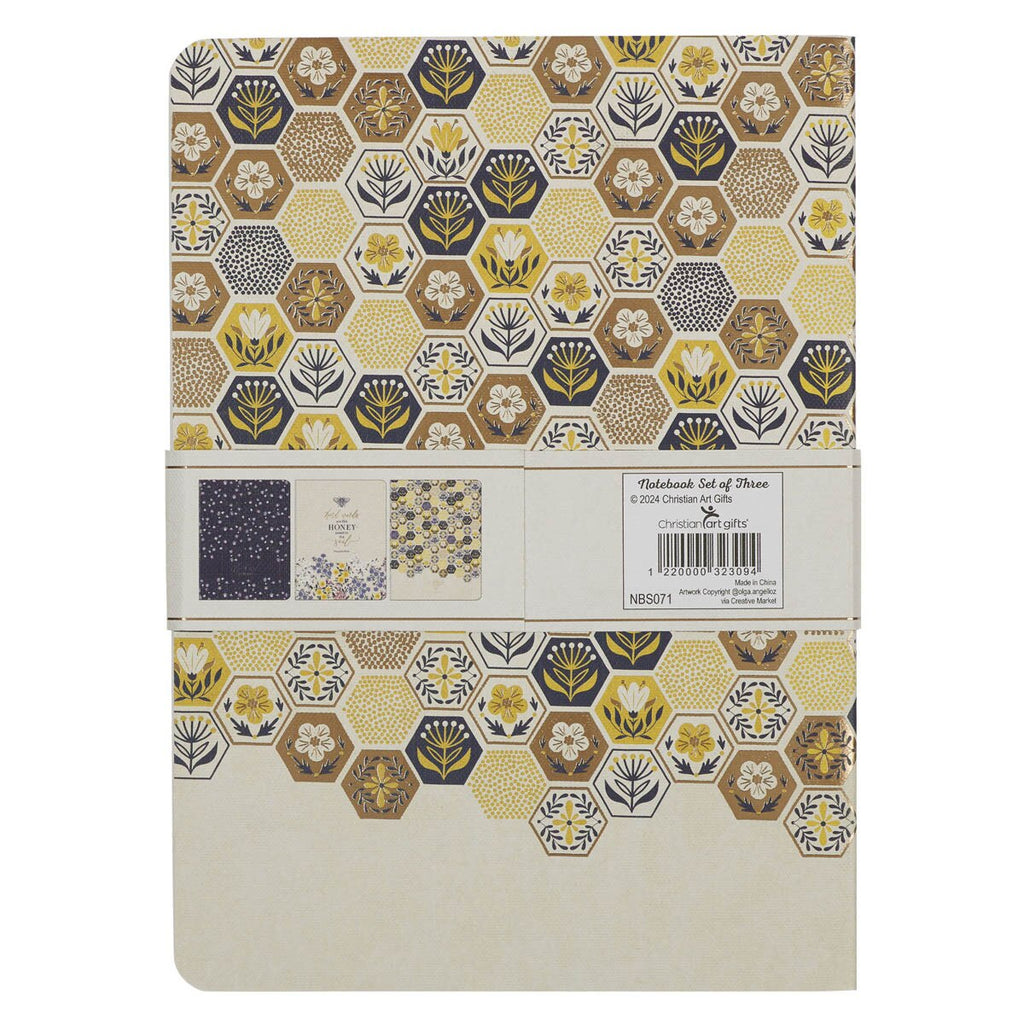 Packaged set of three notebooks with floral hexagonal pattern on a white background