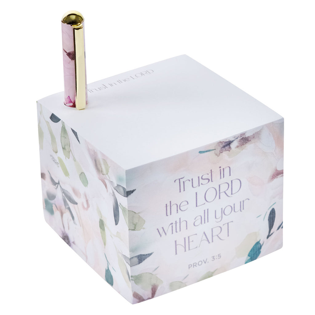 trust in the lord note block with pen on a white background