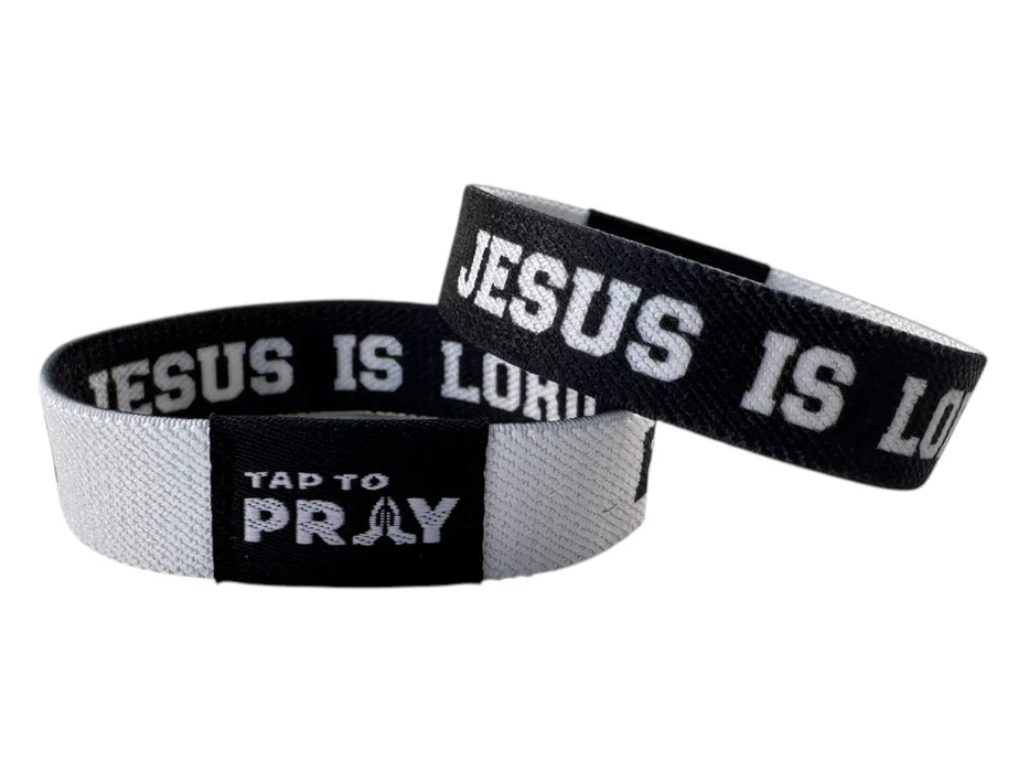 Two wristbands with 'Jesus is Lord' text on a white background