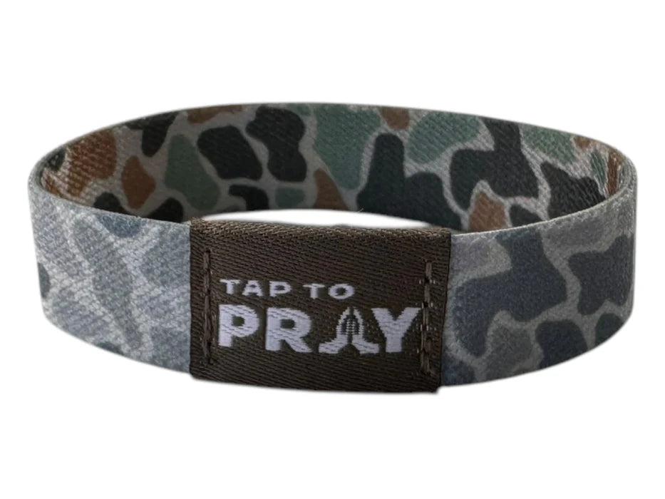 Camouflage wristband with 'Tap to Pray' text on a white background