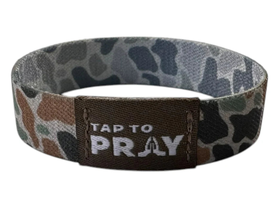 Camo-patterned wristband with 'Tap to Pray' text on a white background