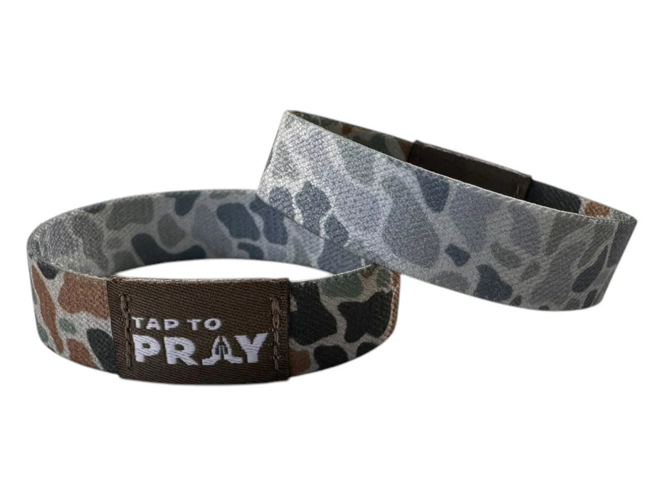 Two wristbands with camouflage pattern and 'Tap to Pray' text on a white background