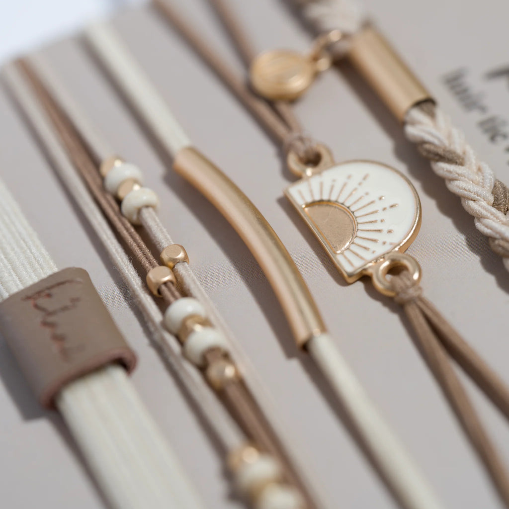 Close-up of a bracelet with decorative elements on a neutral background