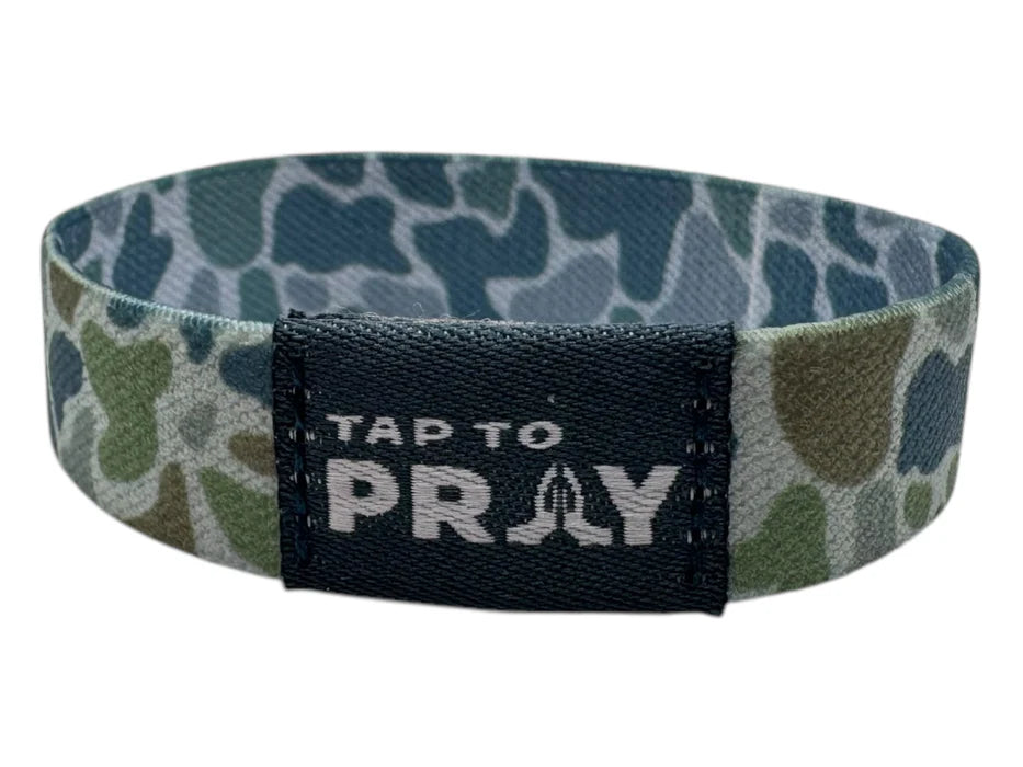 Camouflage-patterned wristband with 'Tap to Pray' text on a white background