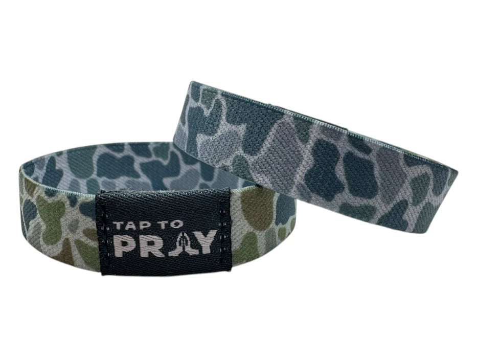 Wristband with camouflage pattern and 'Tap to Pray' text on a white background