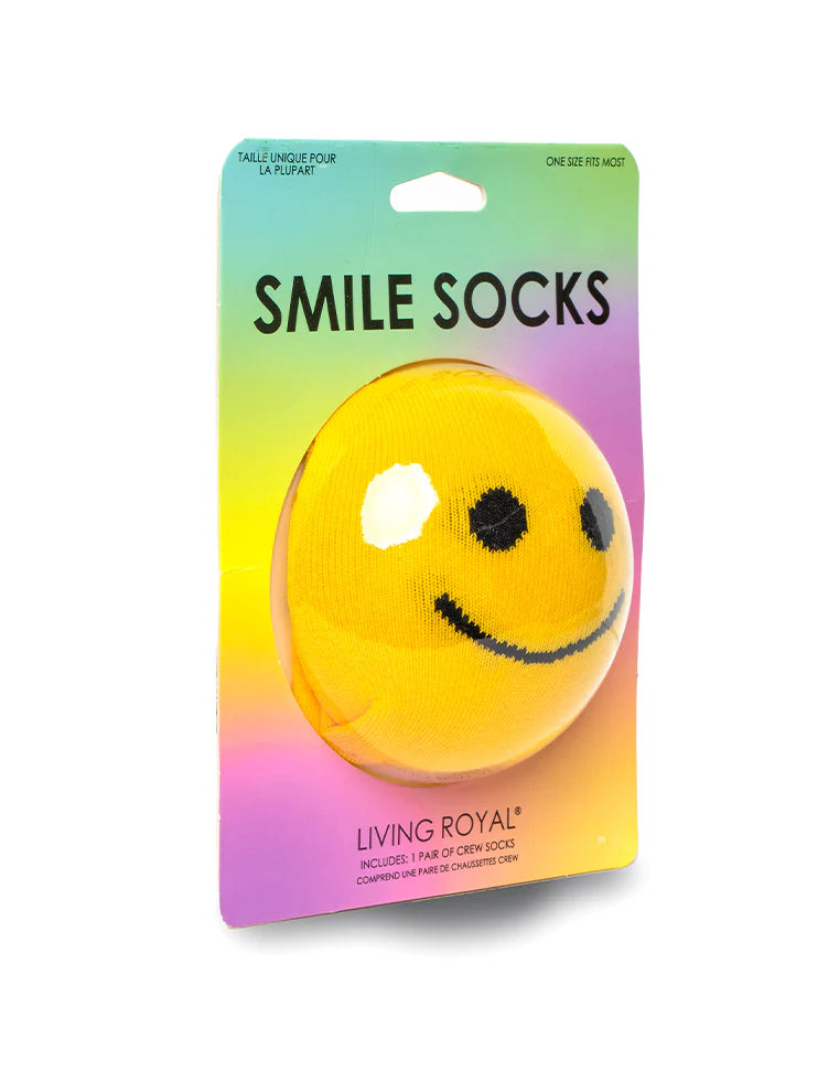 Packaged smiley face socks with a colorful gradient background