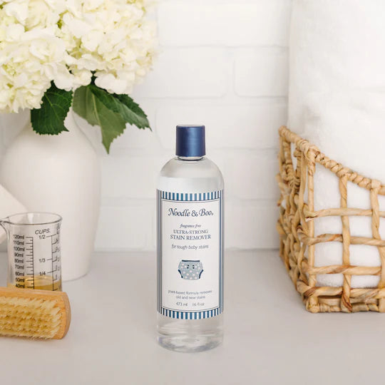 noodle and boo stain remover on a counter in a bathroom