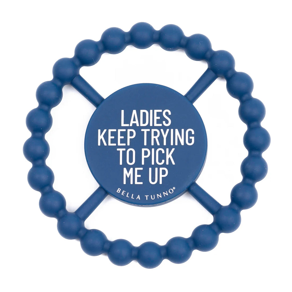 Blue teething ring with humorous text on a white background