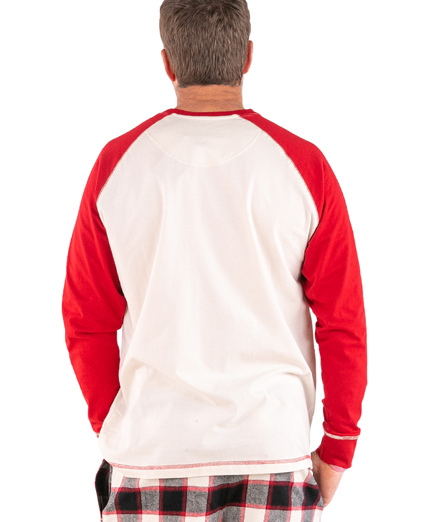 Person wearing a red and white long-sleeve shirt with plaid pants on a white background