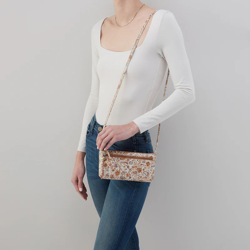 cara crossbody hobo on a white background