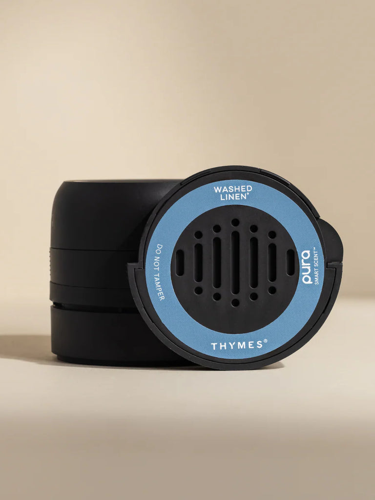 Black and blue diffuser with 'Thymes' branding on a beige background