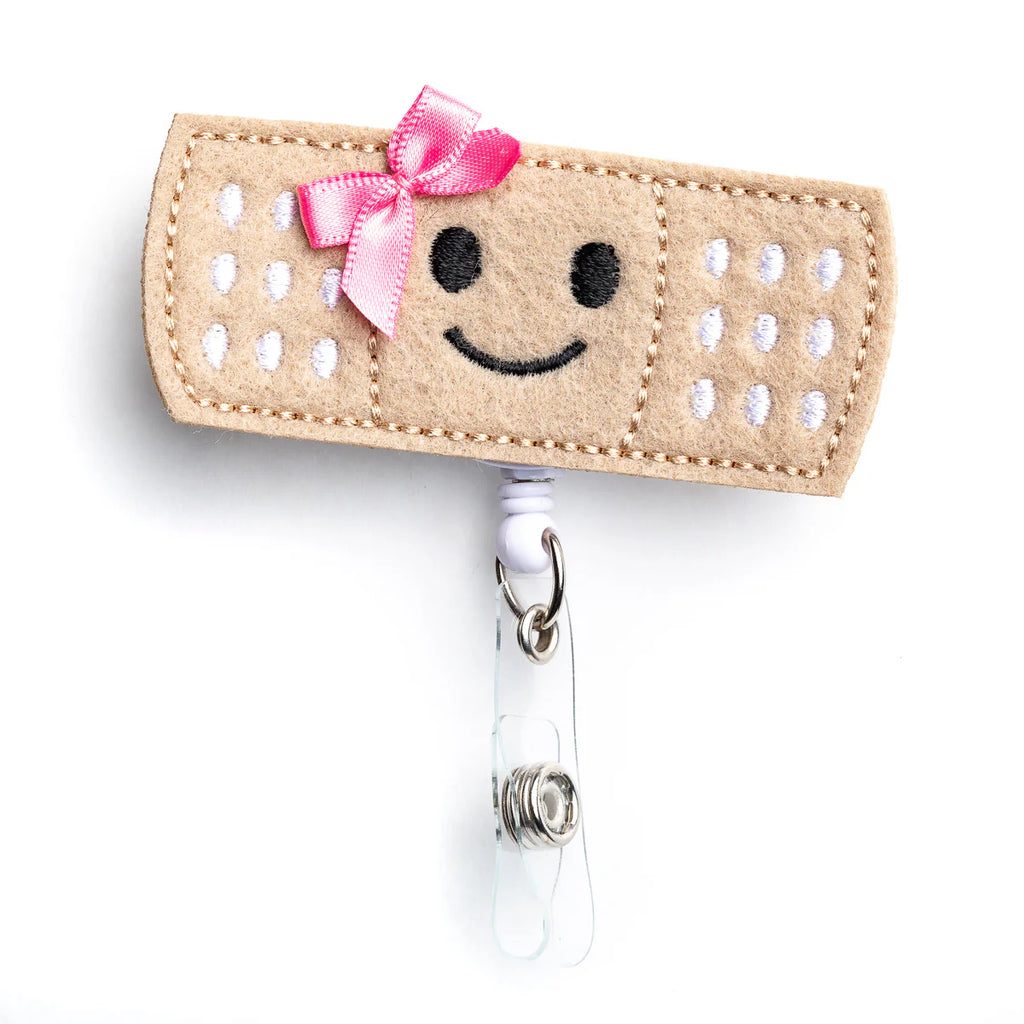 pink bow bandage badge reel holder