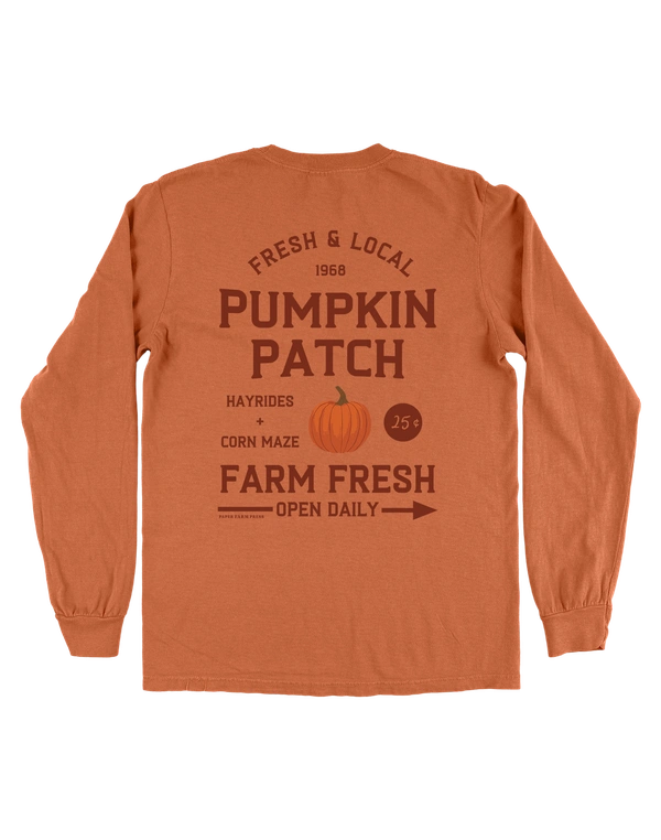 Orange long-sleeve shirt with pumpkin patch-themed text and graphics on a white background