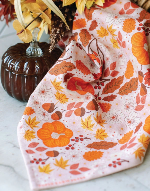 Fabric with autumn leaf pattern on a white surface