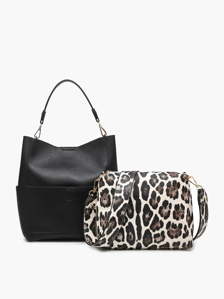 Jen & Co bucket bag black bag with leopard bag sitting on the right with a white background