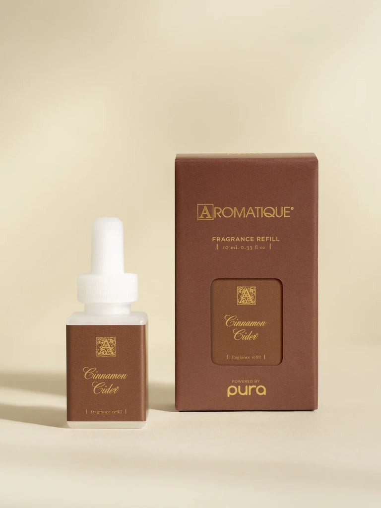 pura aromatique diffuser oil on a cream background