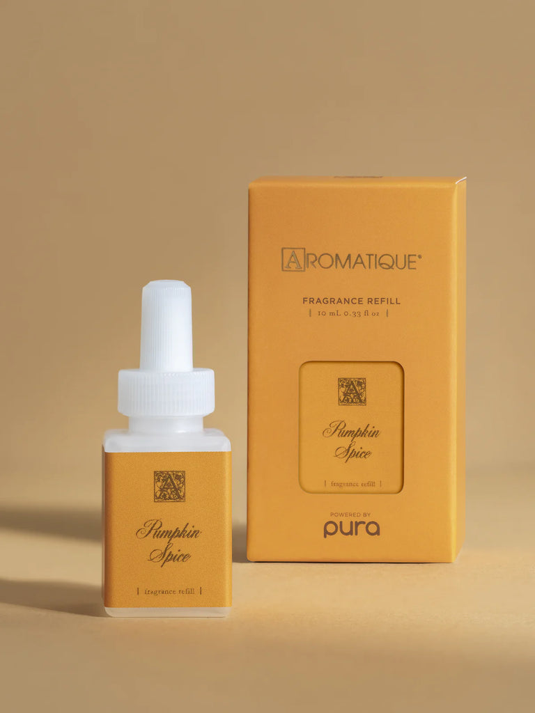 pura aromatique diffuser oil in front of a tan background 