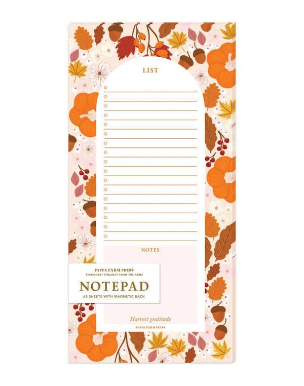 Notepad with autumn-themed design on a white background