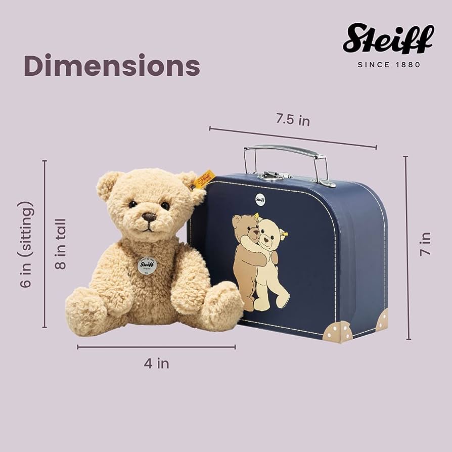 steiff brown bear with blue suitcase on a purple background with dimensions