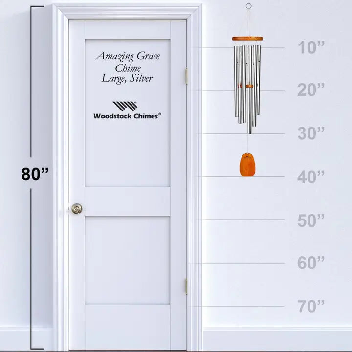 wind chime next to a door with measurements 