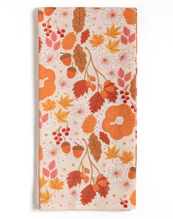 Fabric with autumn-themed pattern featuring leaves, pumpkins, and acorns on a white background