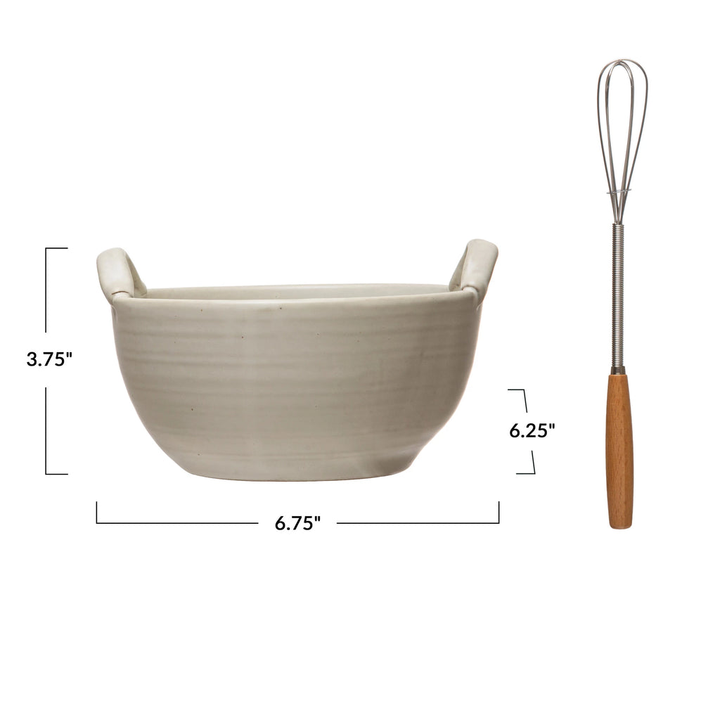 stoneware batter bowl and metal whisk on a white background