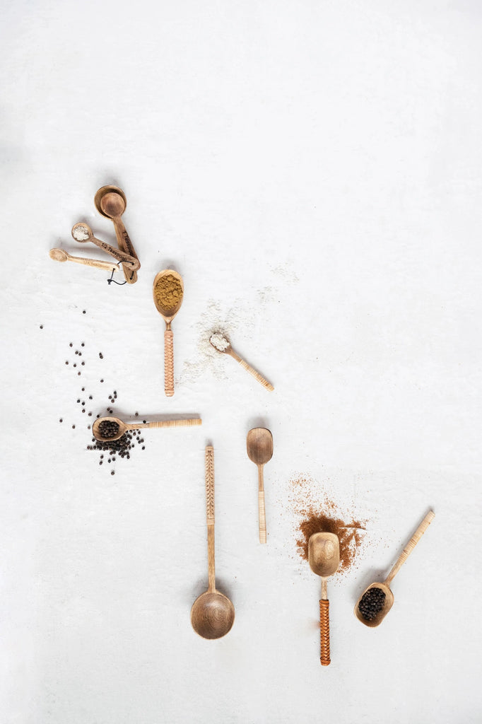 mango wood measuring spoons on a white background