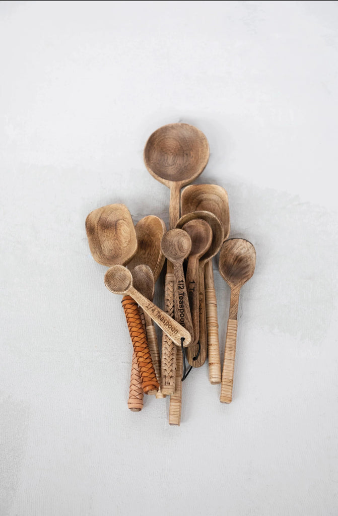 mango wood measuring spoons on a white background