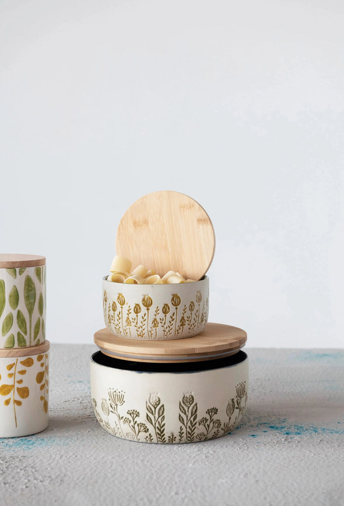 stoneware canister with bamboo lid on a white background