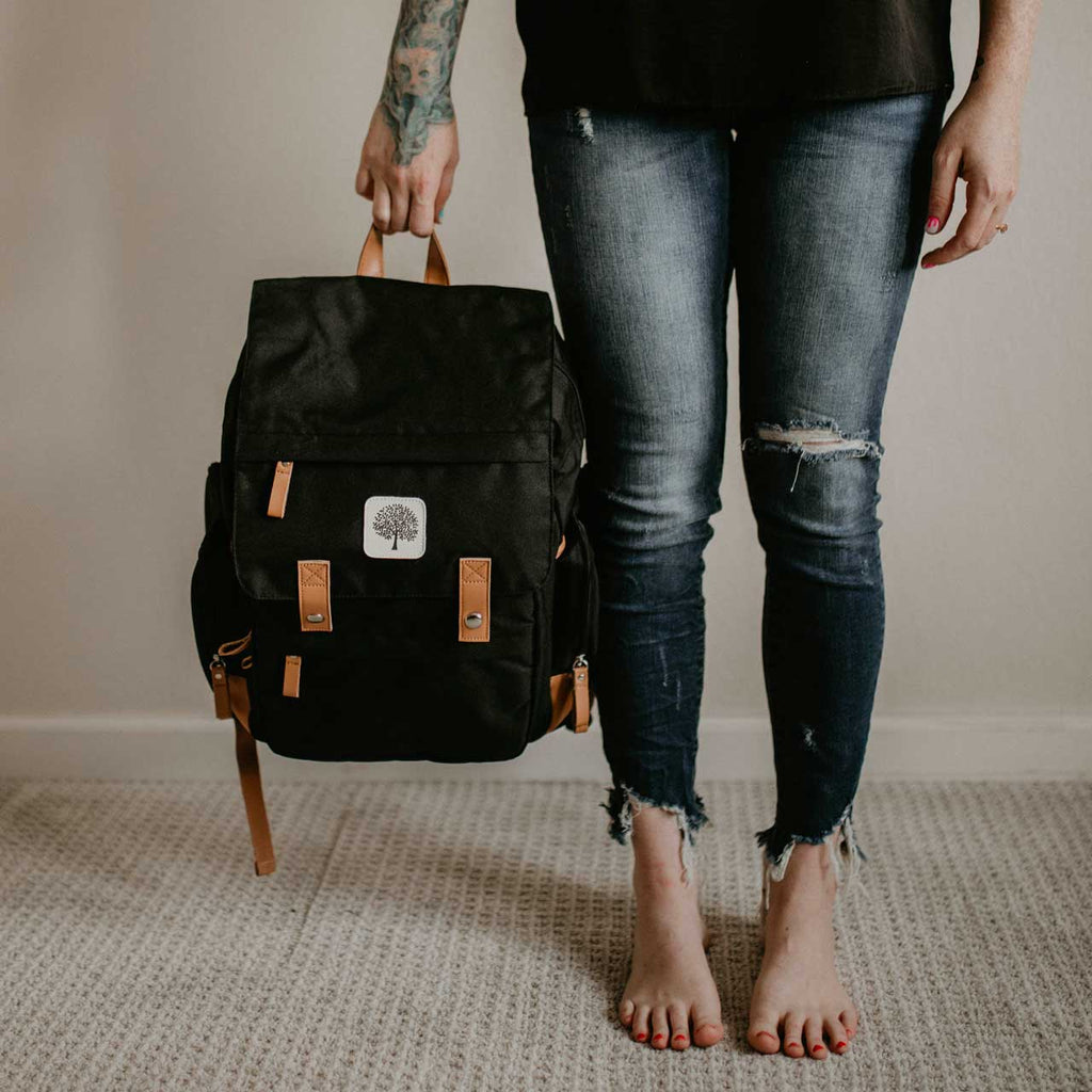 black diaper bag on a white background