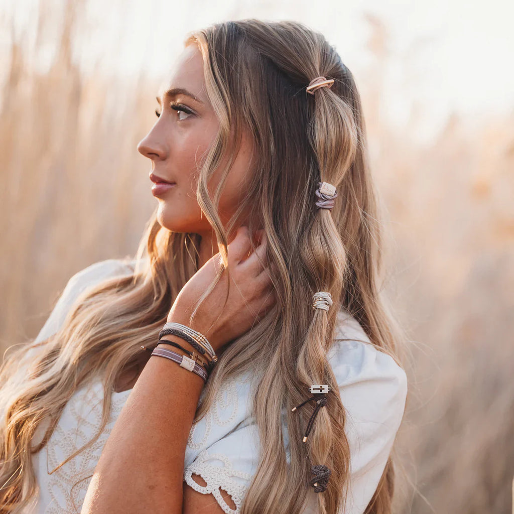Woman with styled hair in a field