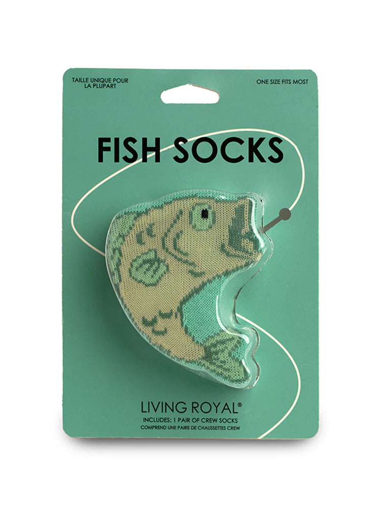 Packaged fish-shaped socks with 'Living Royal' branding on a green background