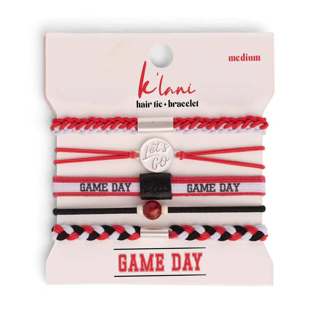 Set of red, white, and black hair ties and bracelets on a 'kálani' branded card.