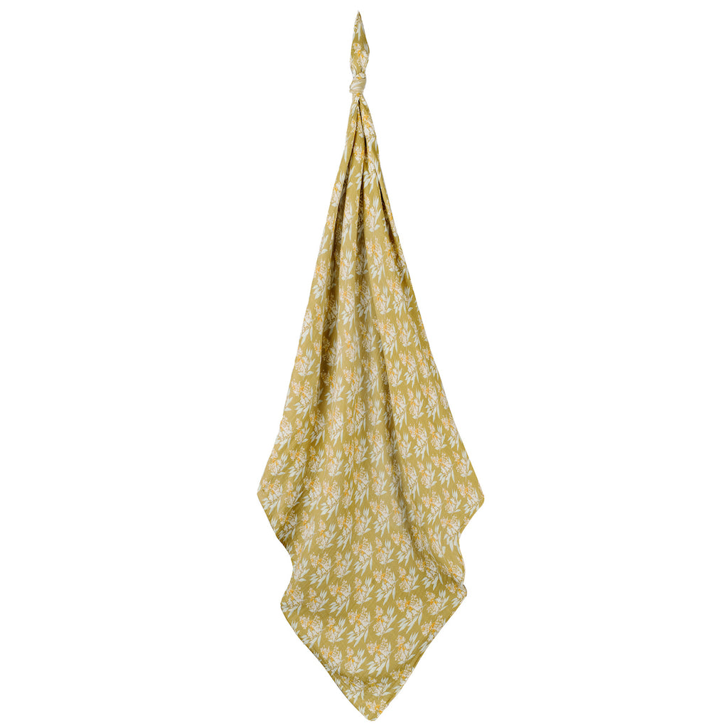 burts bee baby gold floral swaddle on a white background