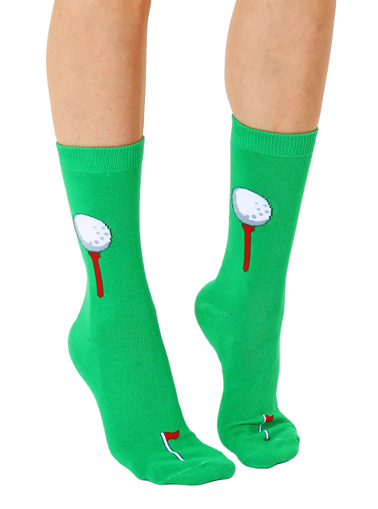 Green socks with golf club and ball design worn by a person on a white background