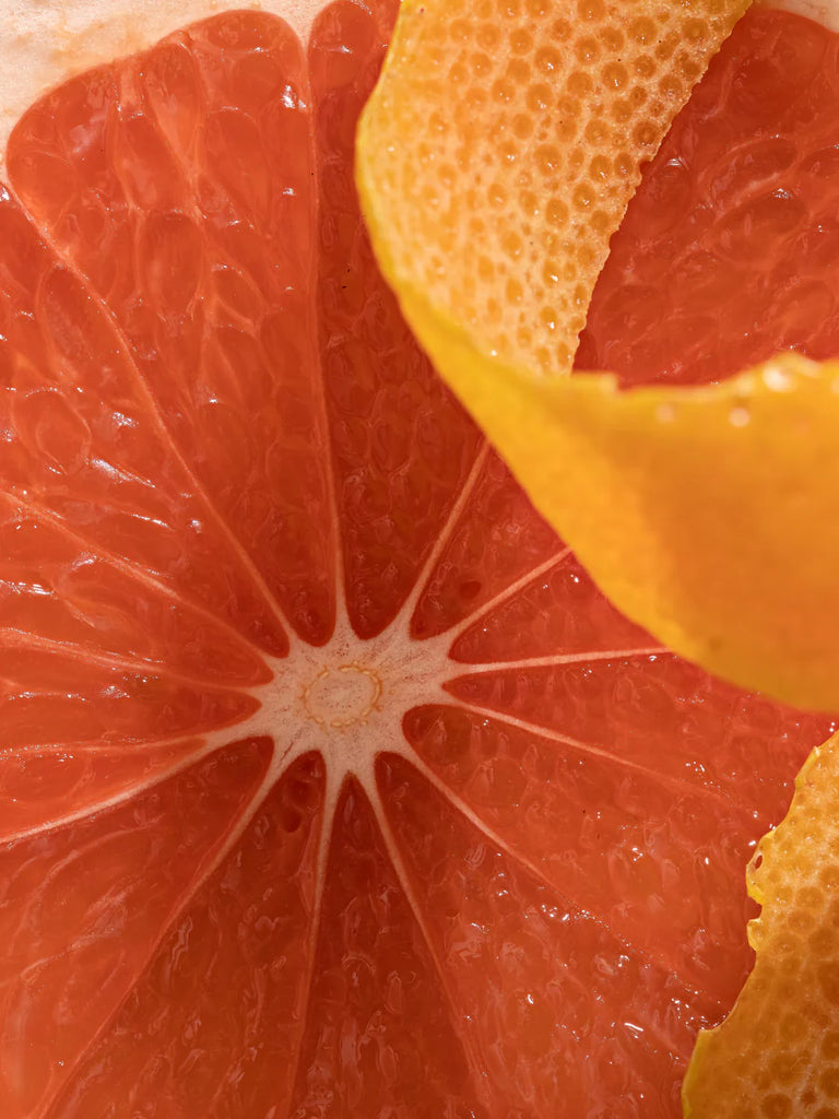 Close-up of a sliced red grapefruit with juicy interior