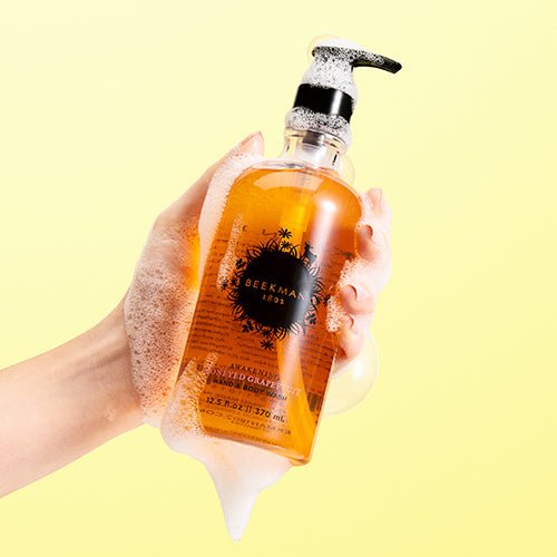 honeyed grapefruit hand and body wash on a yellow background