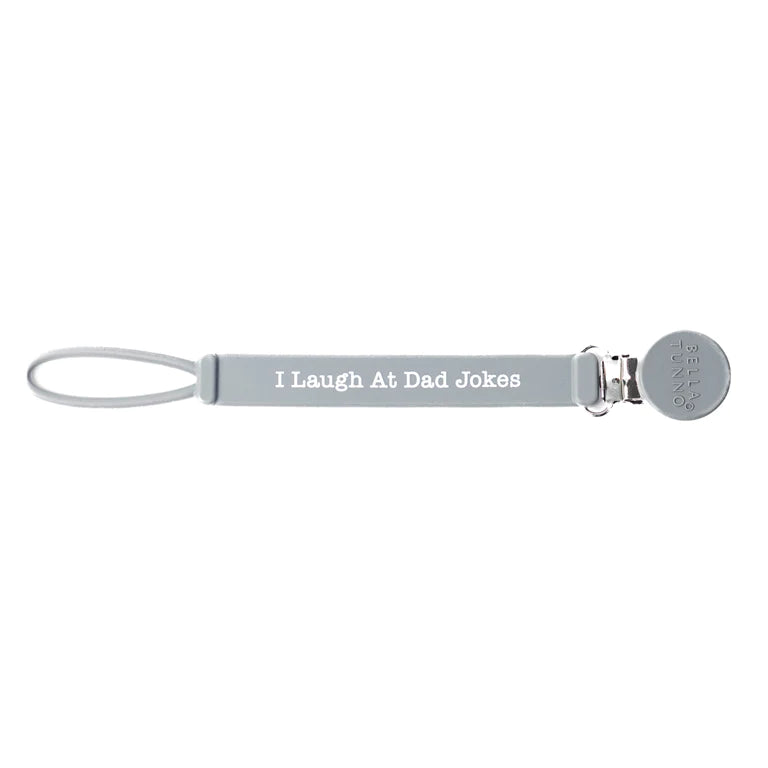 I laugh at dad jokes pacifier clip on a white background