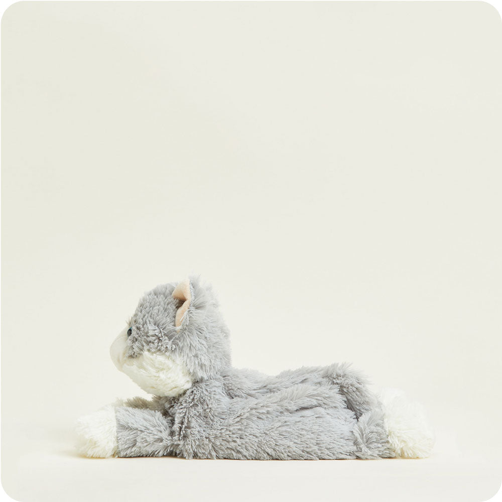 warmies lay flat gray cat on a cream background